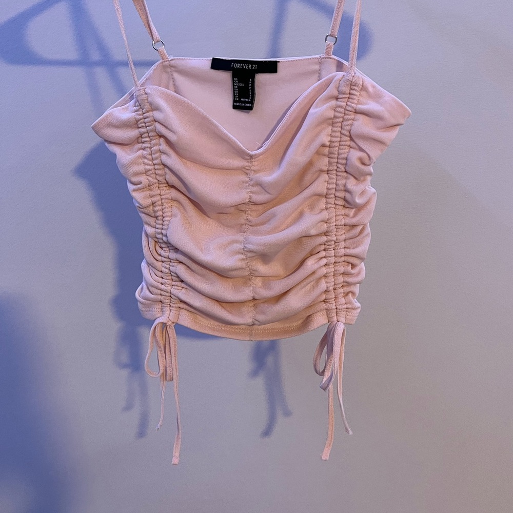 This is a pink forever 21 cropped top, size S.